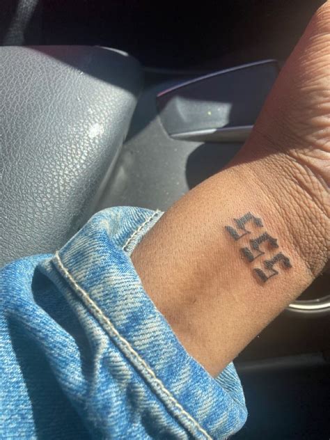 a person with a small tattoo on their wrist