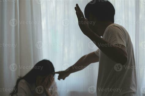 Upset woman having a fight with a man at home. Hispanic wife slapping