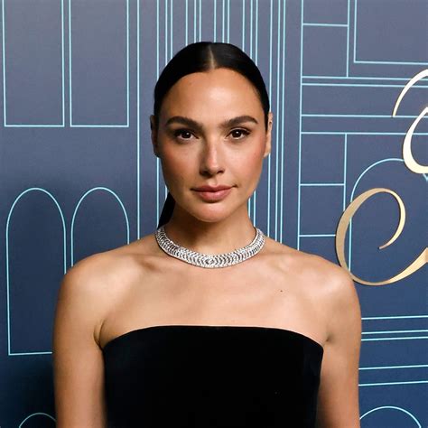 Gal Gadot looks phenomenal in tight-fitting yellow dress as she reveals ...