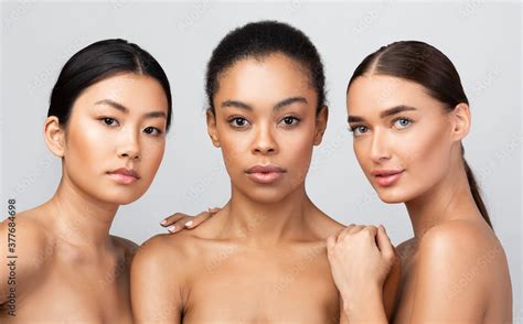sensual multicultural girls posing shirtless standing