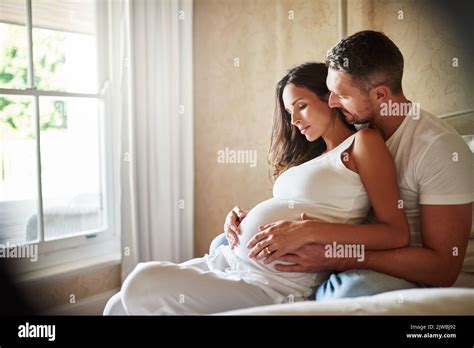 family bonding  husband  pregnant wife sitting