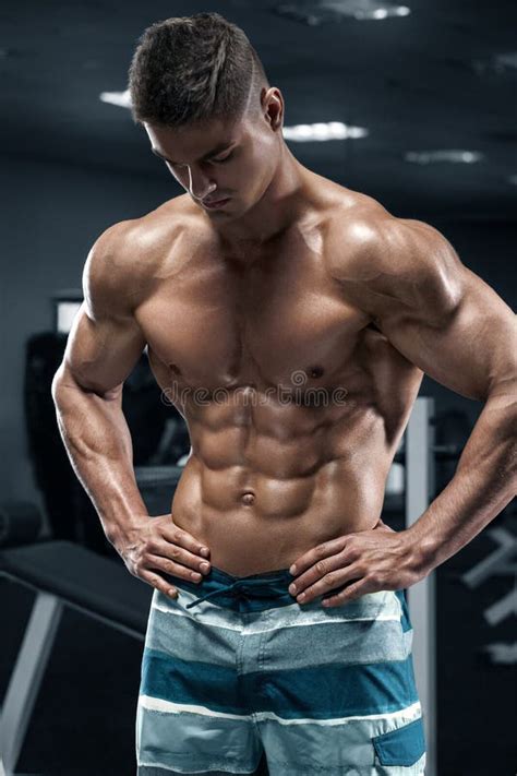 Muscular Man in Gym, Abs, Working Out. Strong Male Naked Torso, Shaped