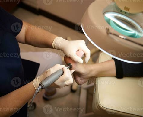 High angle view of woman foot during professional feet treatment in