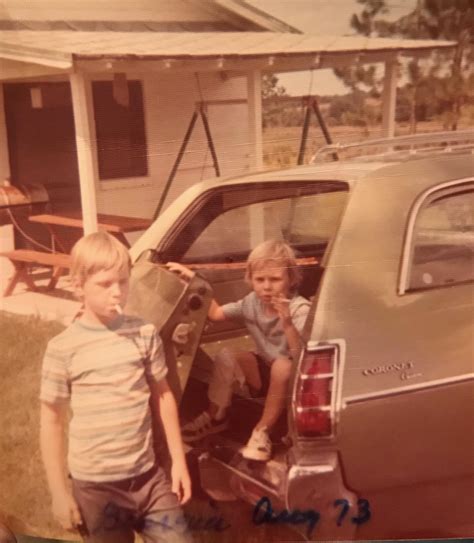 My buddy smoking cigarettes with his sister in the back of a station