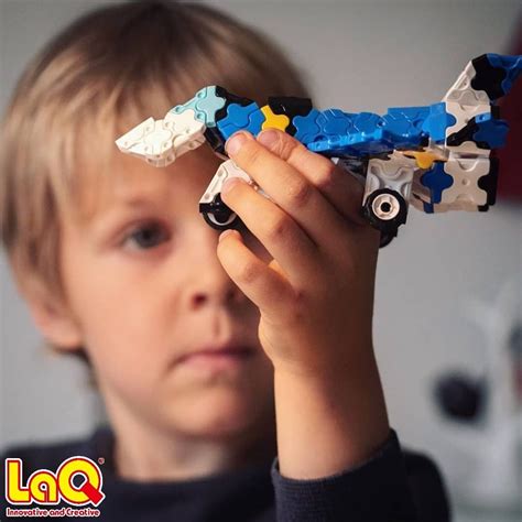 Admiring his LaQ masterpiece, the LaQ Jet Fighter 🛩 . This set includes ...