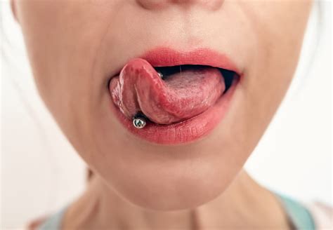 Closeup Of Womans Mouth With Tongue Sticking Out Piercing On A Womans Tongue Stock Photo ...