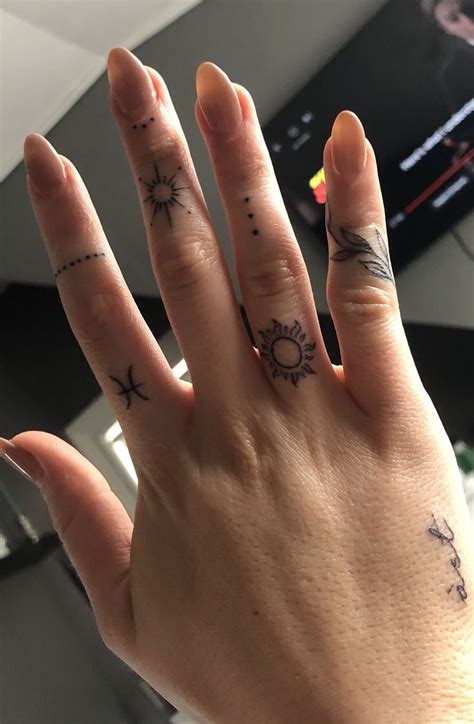 small symbol finger tattoos