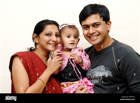 Indian family, parents with baby girl, husband wife with daughter