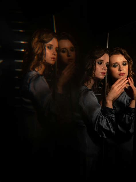 A Naked Woman Covered Grease Sitting on the Floor with Light · Free