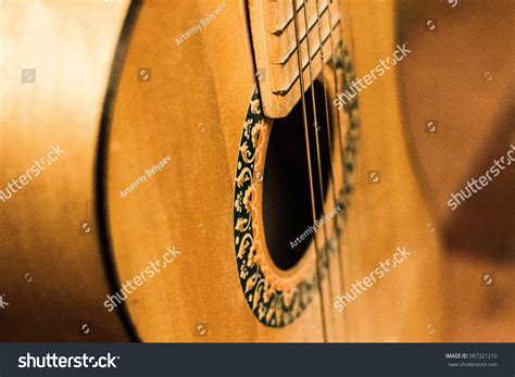 isolated yellow guitar closeup stock photo edit