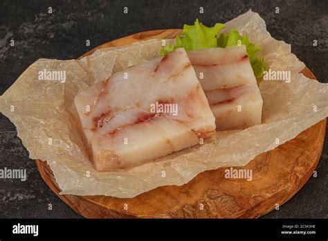 Raw dietary pollock fish fillet for cooking Stock Photo - Alamy