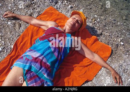 mature nude woman   beach stock photo alamy
