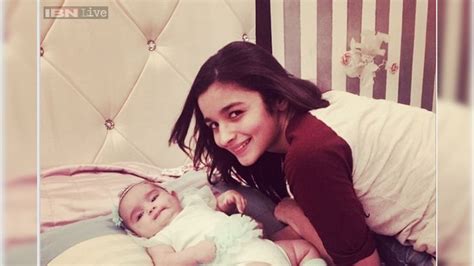 Snapshot: Alia Bhatt looks excited as she cuddles up to a baby girl