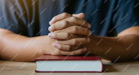 premium photo hands  man  bible prayingchristian life prayer