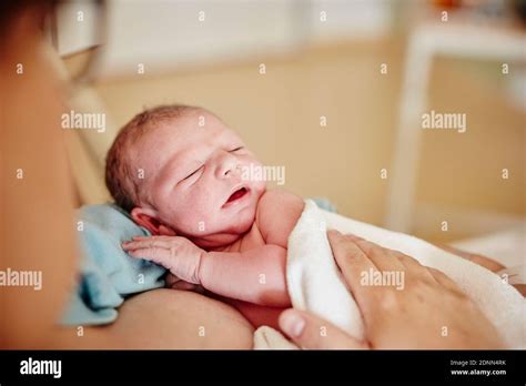 Mother holding newborn baby Stock Photo - Alamy