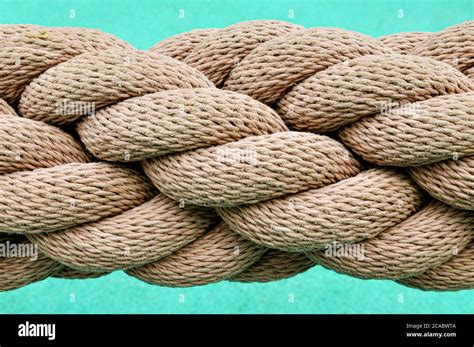 A close up image of a thick industrial rope, with many rope lengths ...