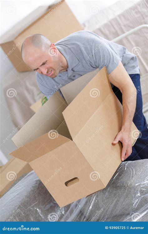 man holding heavy box stock image image  deliver transport