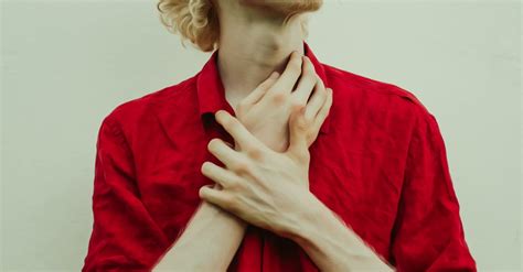 man holding  neck  stock photo