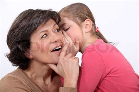 Telling her mother a secret | Stock image | Colourbox