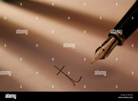 Detail of a fountain pen writing the letter T Stock Photo - Alamy