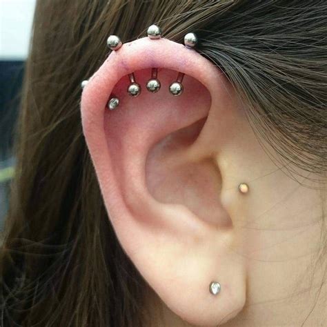 has done some amazing triple helix piercings recently! For more awesome ...
