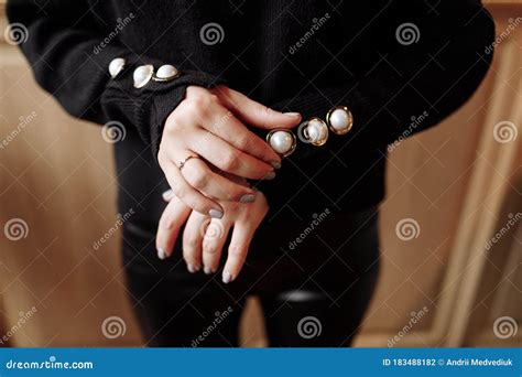 cropped photo   stylish woman  black outfit  pearls details