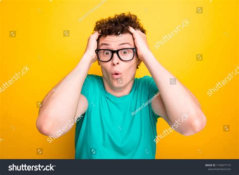young attractive handsome shocked guy wearing stock photo