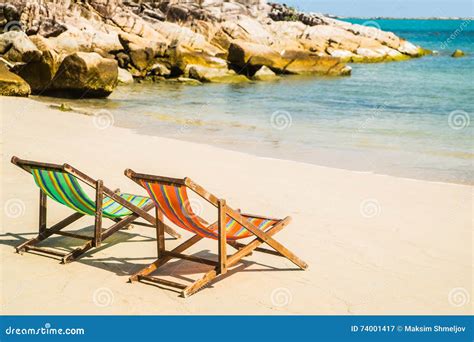 Lounge Chairs on a Tropical Beach at Summer Stock Image - Image of blue ...