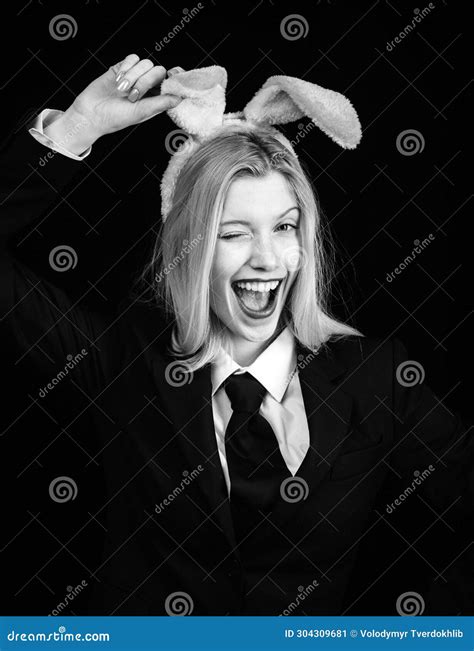 Pretty Bunny Girl Winking and Tongue Out. Happy Woman in Bunny Ears