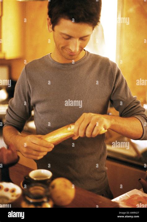 man breaking bread stock photo alamy