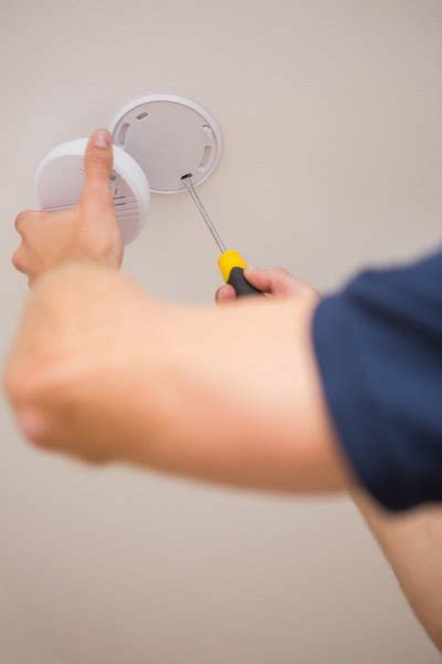 Smoke detector installation Stock Photos, Royalty Free Smoke detector ...