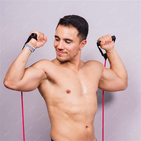 Premium Photo | Fit young athlete preparing for bicep muscle arms