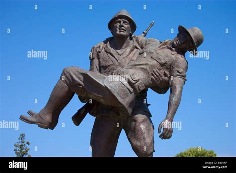 Statue of a Turkish soldier carrying an injured ANZAC soldier back to ...