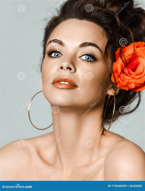 Portrait of Young Beautiful Brunette Naked Woman in Circle Earrings
