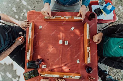 Premium Photo | A group of men drink traditional turkish tea and play a ...