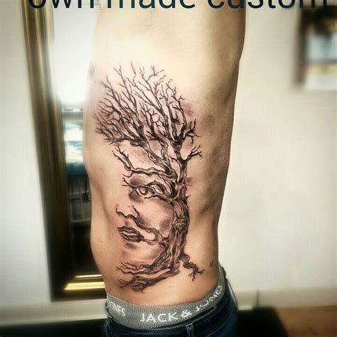 tree with face tattoo - Alina Whited