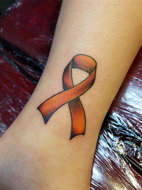 Details 64+ orange ribbon tattoo latest - in.cdgdbentre