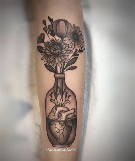 My lastest and favorite tattoo I’ve gotten. Flowers for my children’s ...