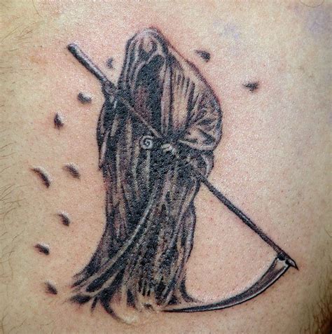 Spooky grim reaper with scythe tattoo - Tattooimages.biz