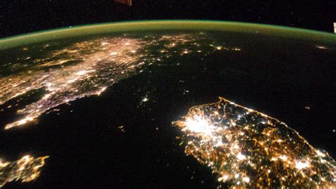 North Korea shrouded in darkness in stunning new photo from space ...