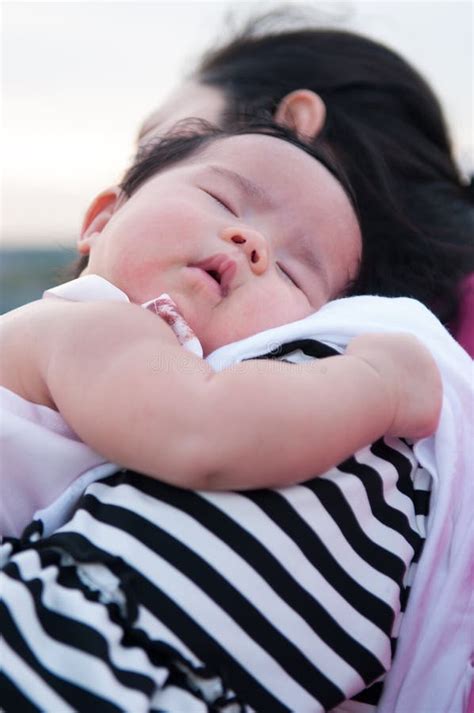 Mother Holding Her Newborn Baby in Dress while Her Was Sleeping. Baby ...