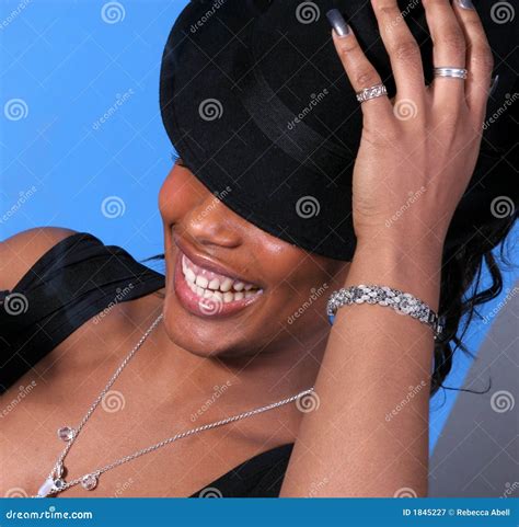 Laughing Woman Holds Hat stock image. Image of giggly - 1845227