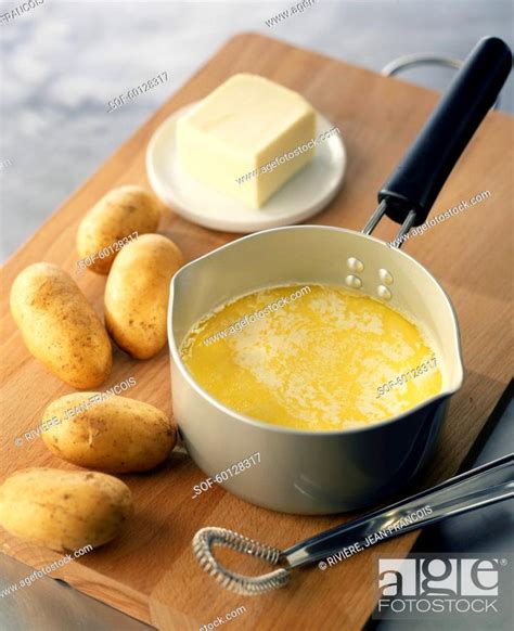 melting the butter in a saucepan, Stock Photo, Picture And Royalty Free Image. Pic. SOF-60128317 ...