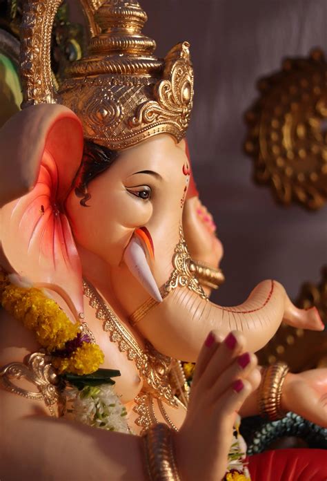 Download Side-angle God Ganesh Statue Wallpaper | Wallpapers.com