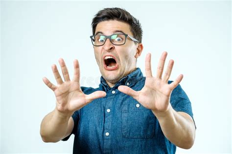 man  scared expression   face making frightened gesture stock