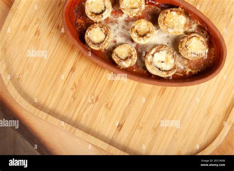 Baked white mushrooms in butter Stock Photo - Alamy