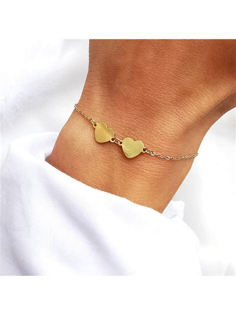 Bransoletka z dwoma serduszkami z piórkiem złota stal chirurgiczna