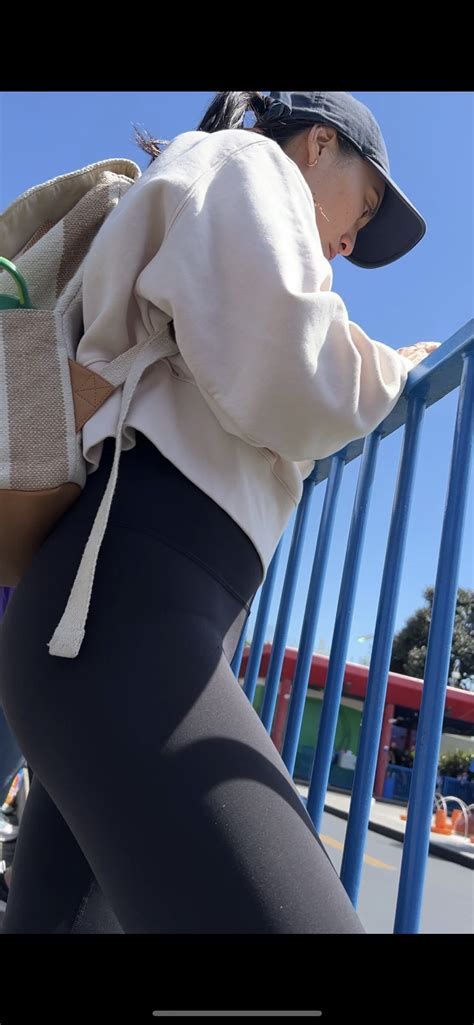 Hottie Asian milf in yoga pants at theme park (video) - Spandex
