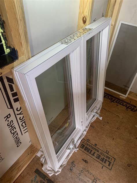 Installing a window without a nail fin in new construction. Pella has