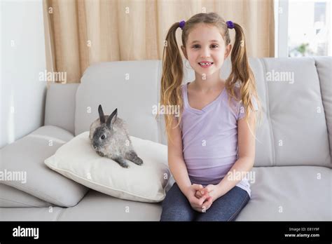 Cute little girl with her pet bunny Stock Photo - Alamy